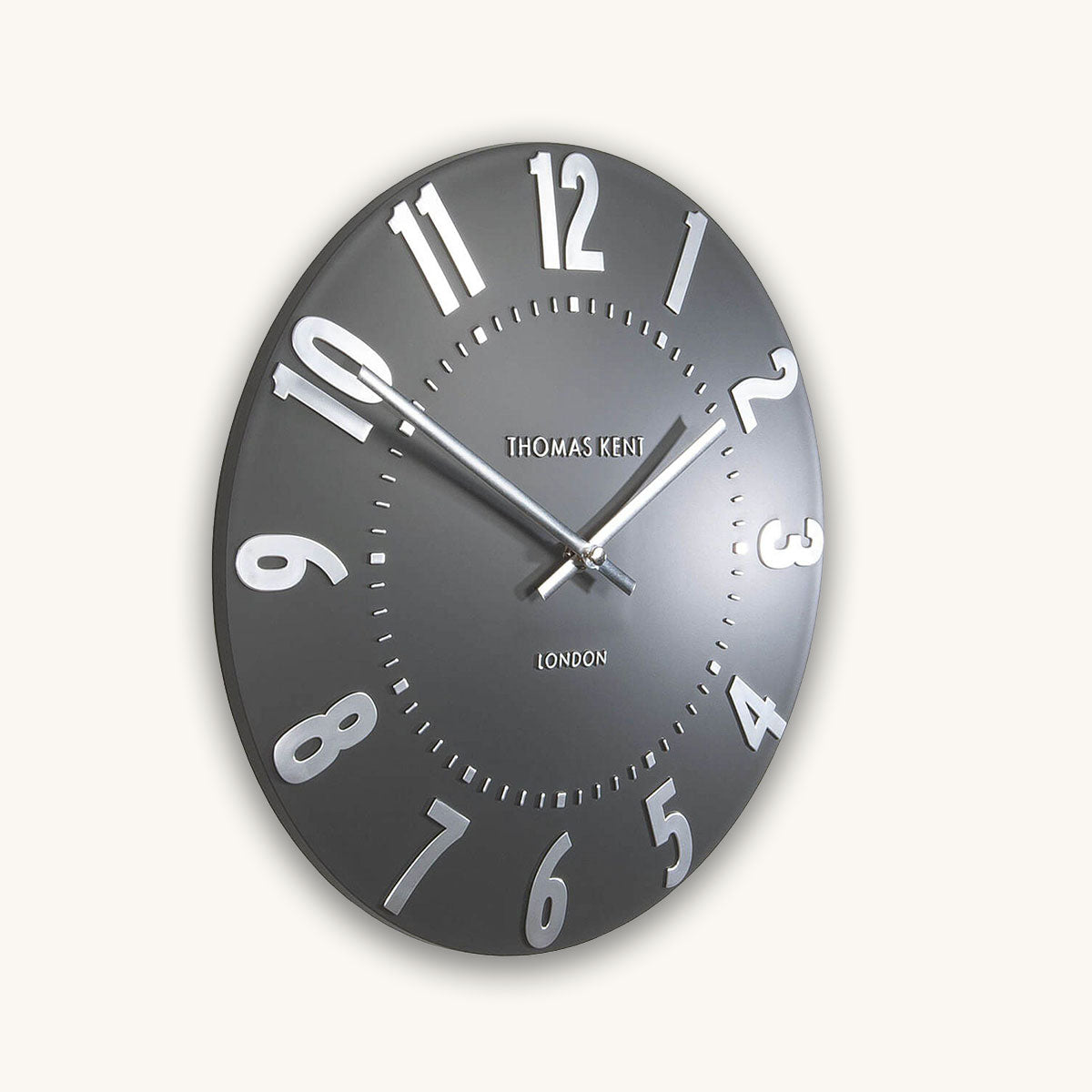 Wall clock with black face and white numbers on a white background