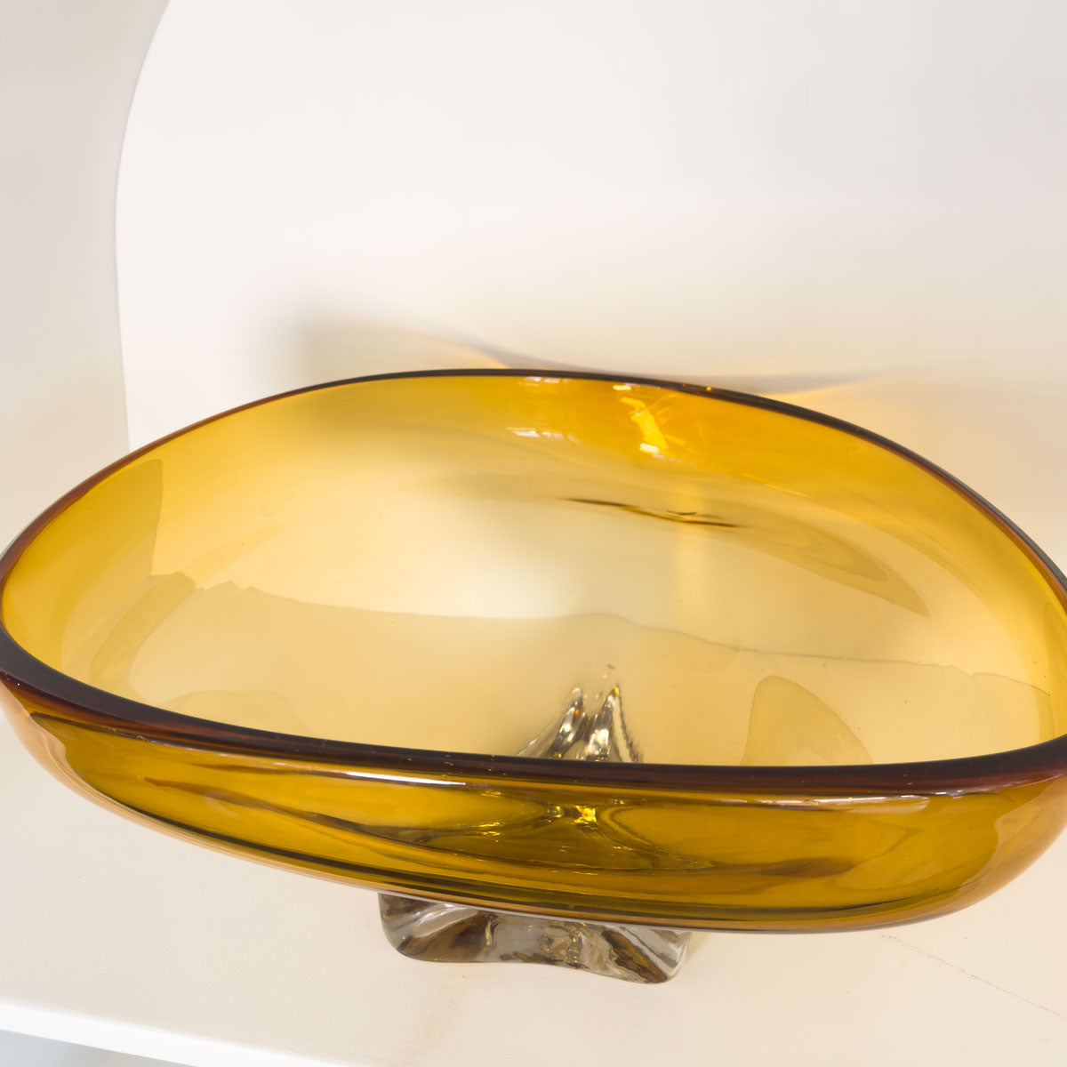 Amber glass bowl on a white background