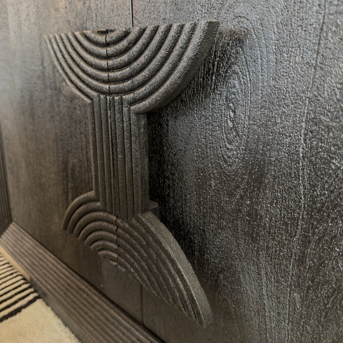 Decorative sideboard handle with geometric carvings
