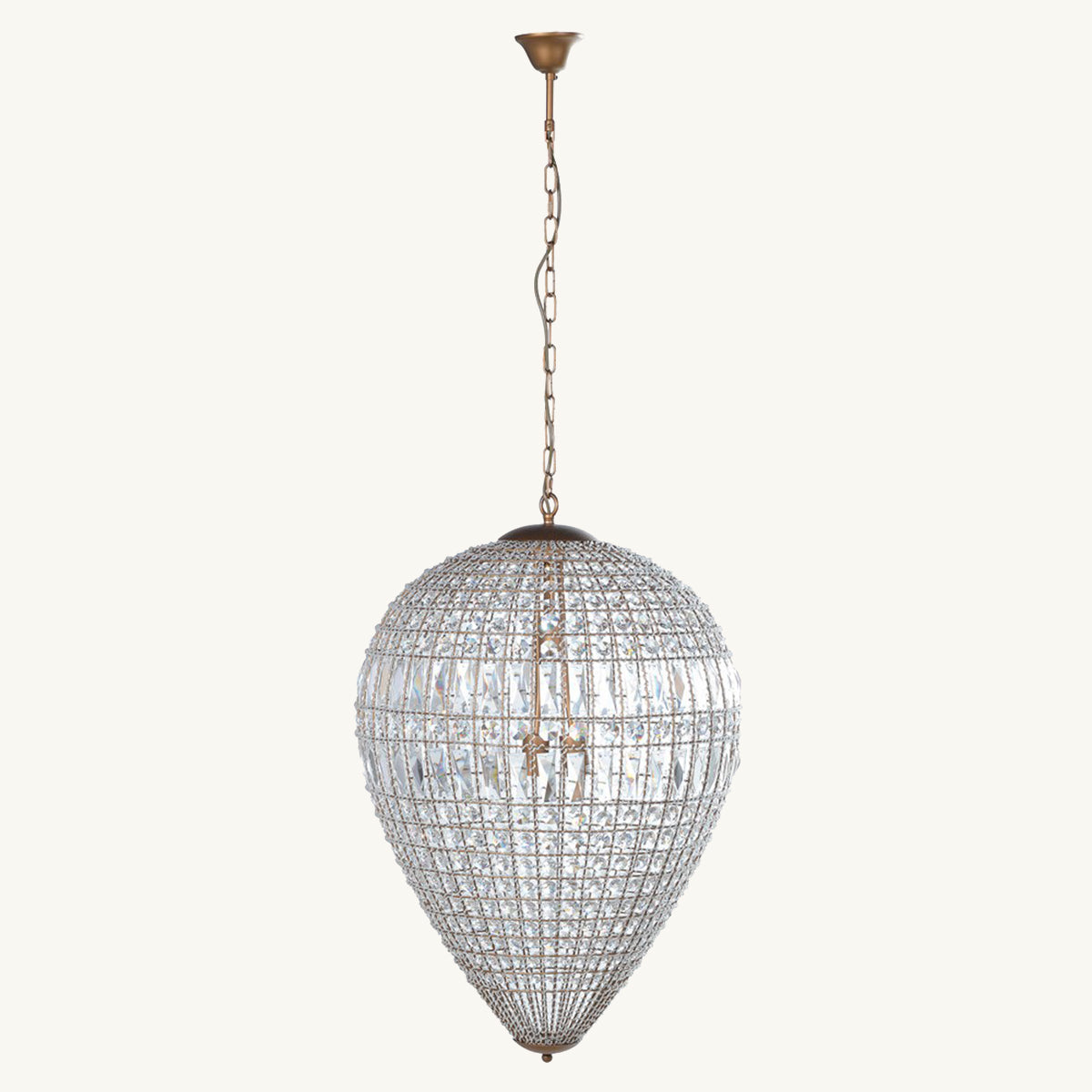 A large teardrop-shaped crystal chandelier with brass hardware, hanging by a chain.