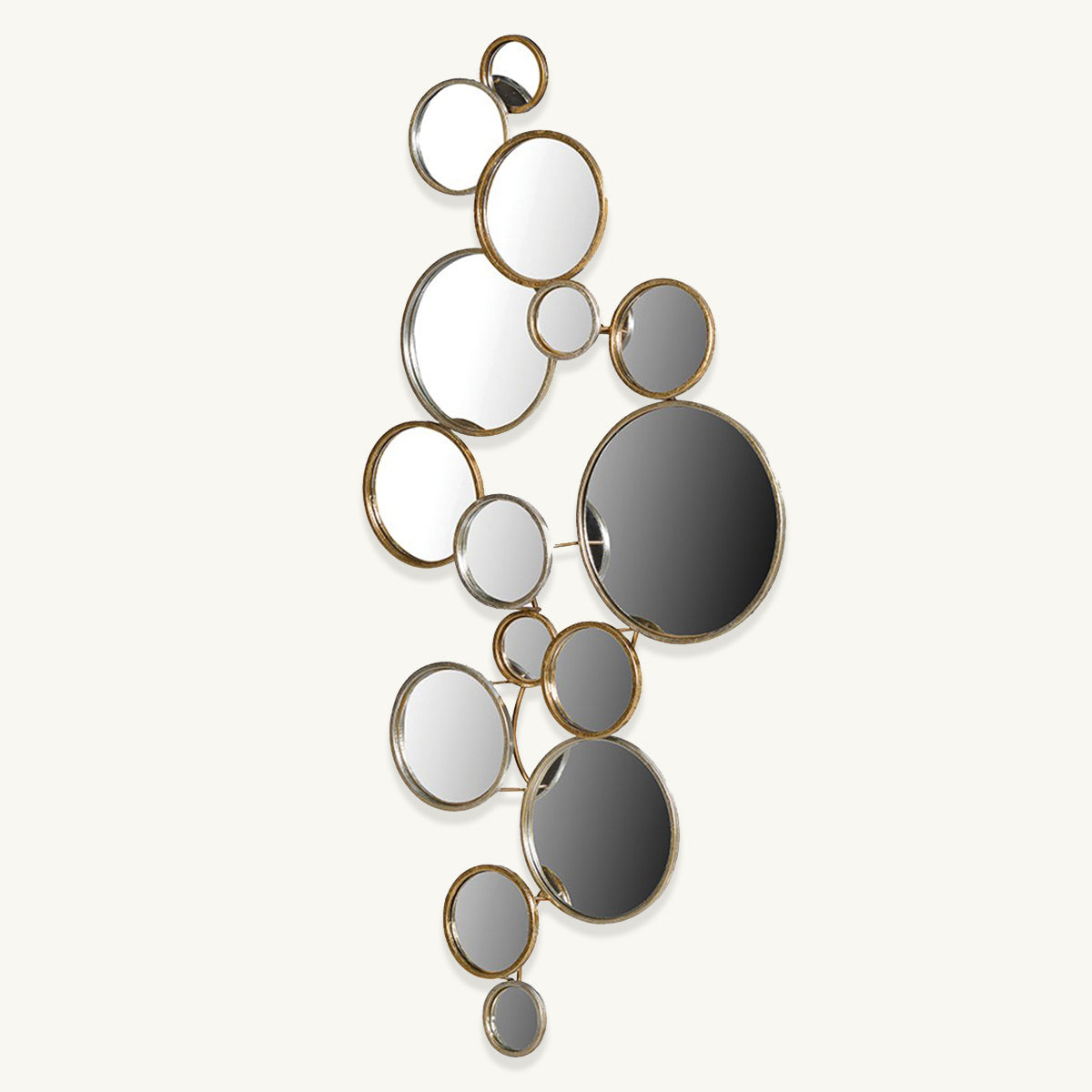 A gold-framed abstract circular mirror arrangement hanging on a wall