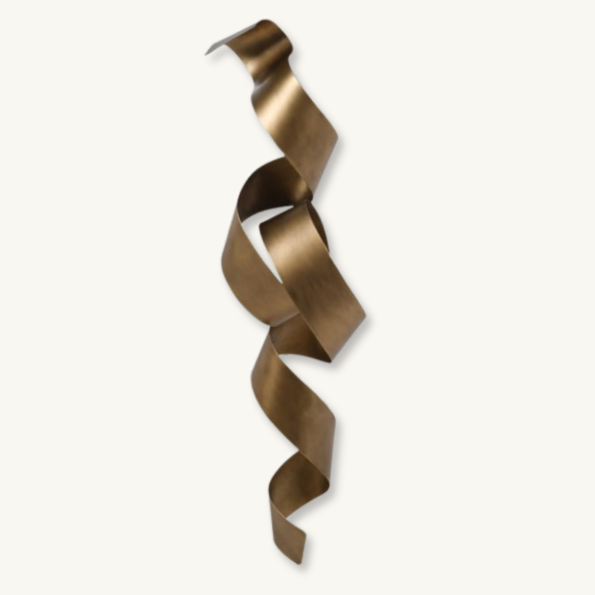 Abstract bronze metal sculpture of a long, twisting ribbon suspended against an off-white background.