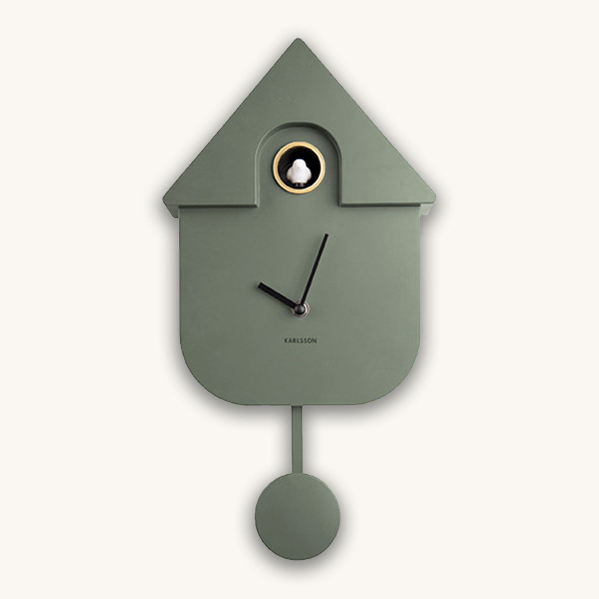 Green cuckoo clock with a white clock face on a white background