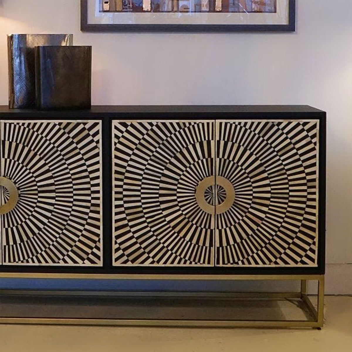 Decorative monochrome cabinet with geometric pattern on a plain wall background