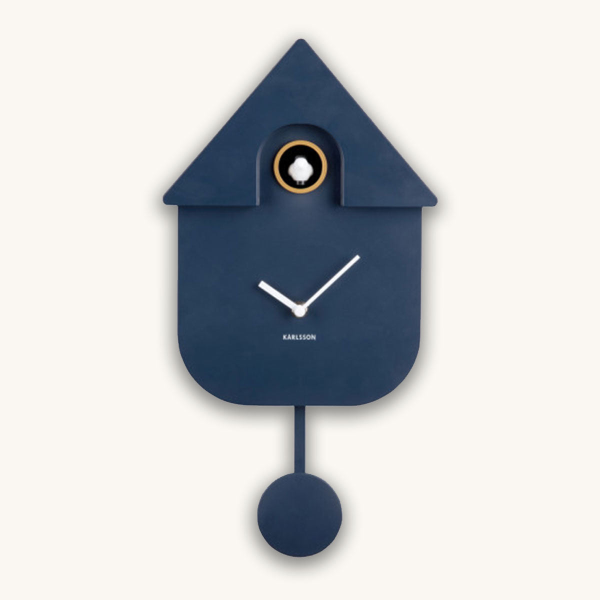 Blue cuckoo clock with a white clock face on a white background