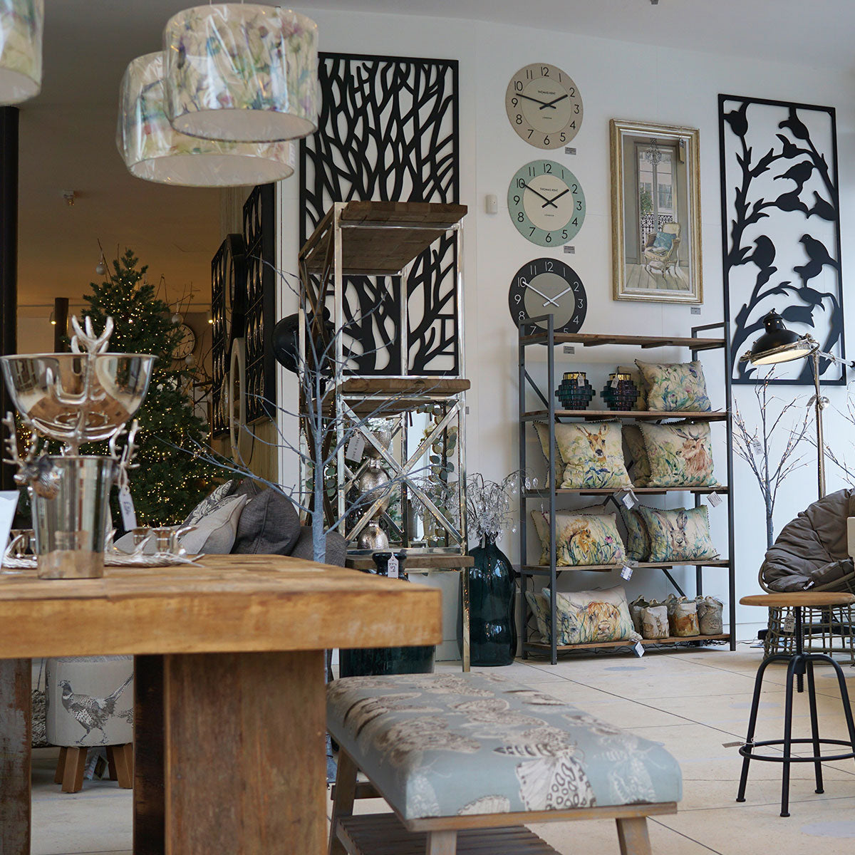 Decorative interior with furniture, cushions, and wall art in a home setting.