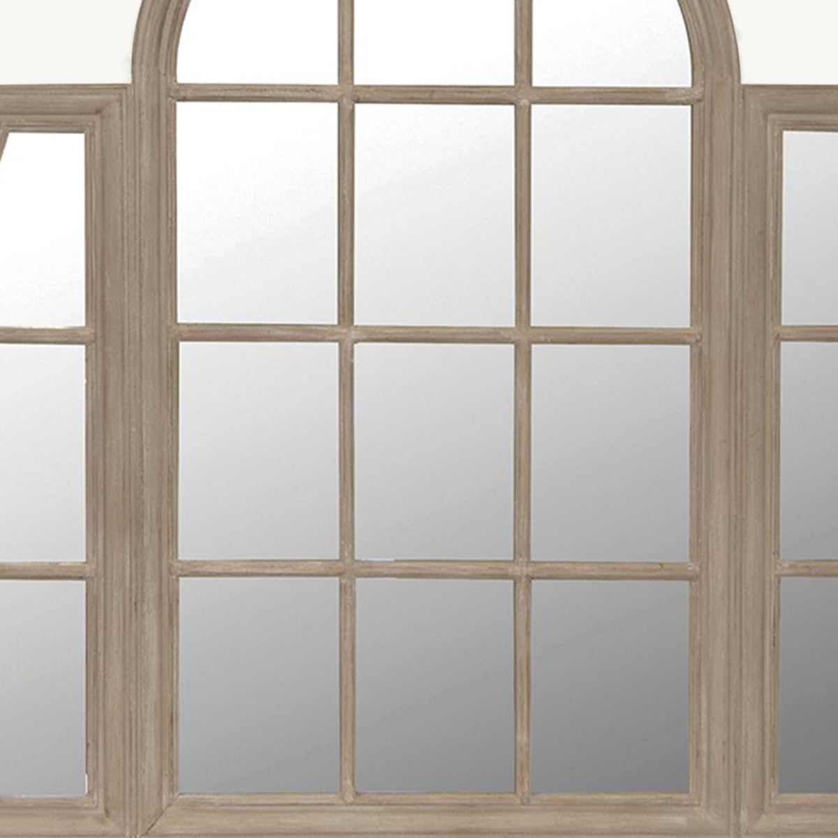 A close up of a paulowina wood windowpane style mirror.