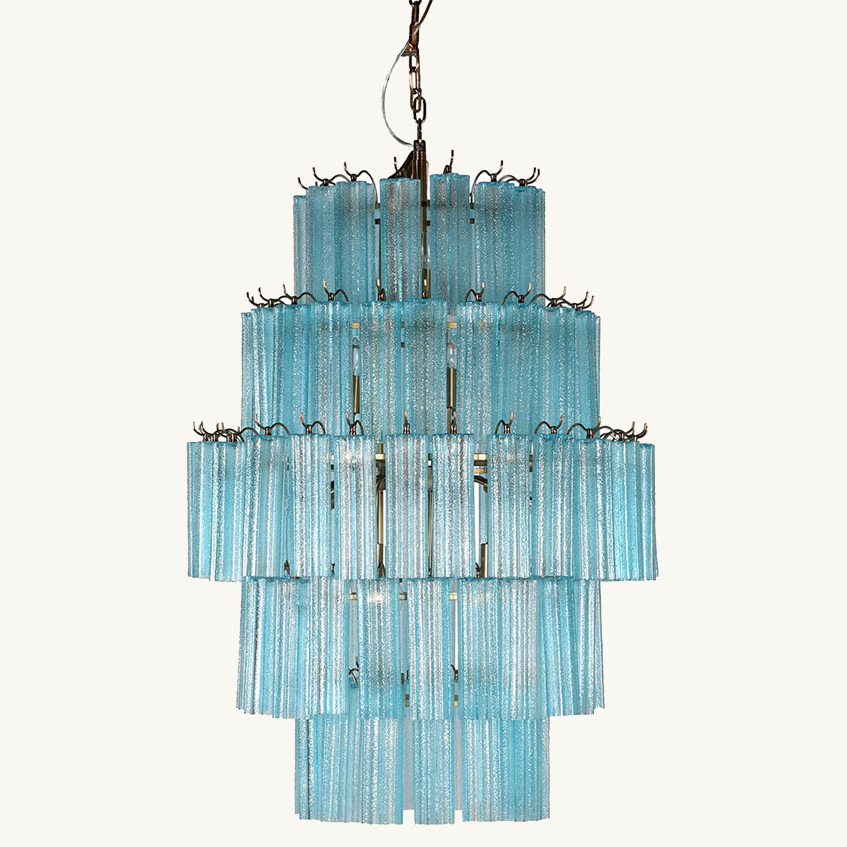 A turquoise tiered glass chandelier with a retro design, featuring layers of sparkling glass droplets.
