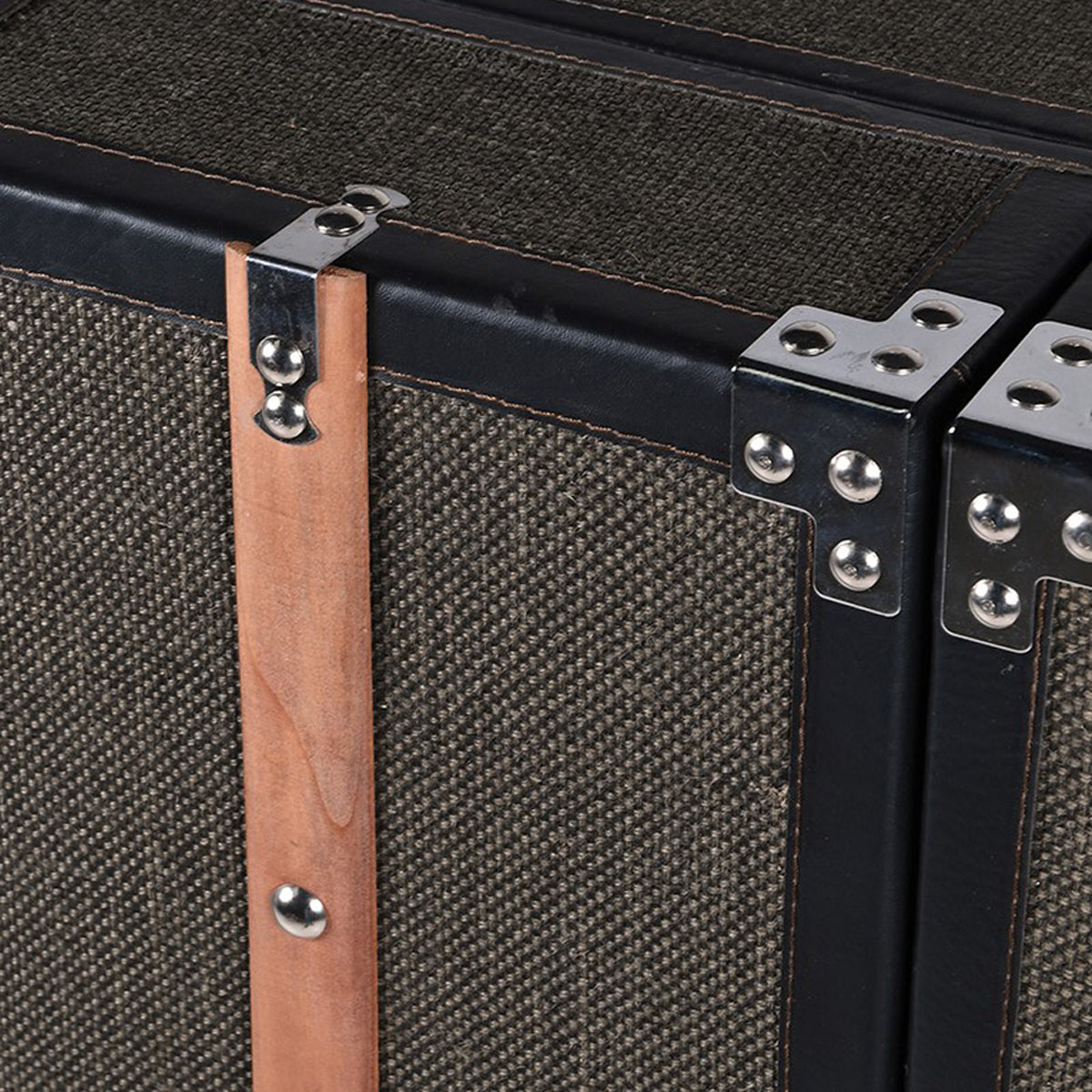 Close-up of a tweed bar cabinet with wooden handle and metal hardware