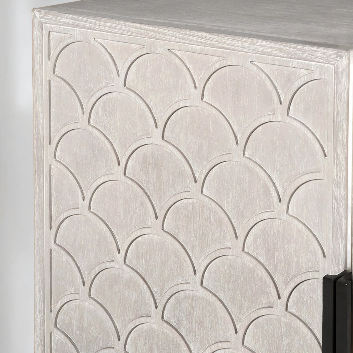 Decorative scalloped cabinet with a scalloped pattern on the doors on a neutral background