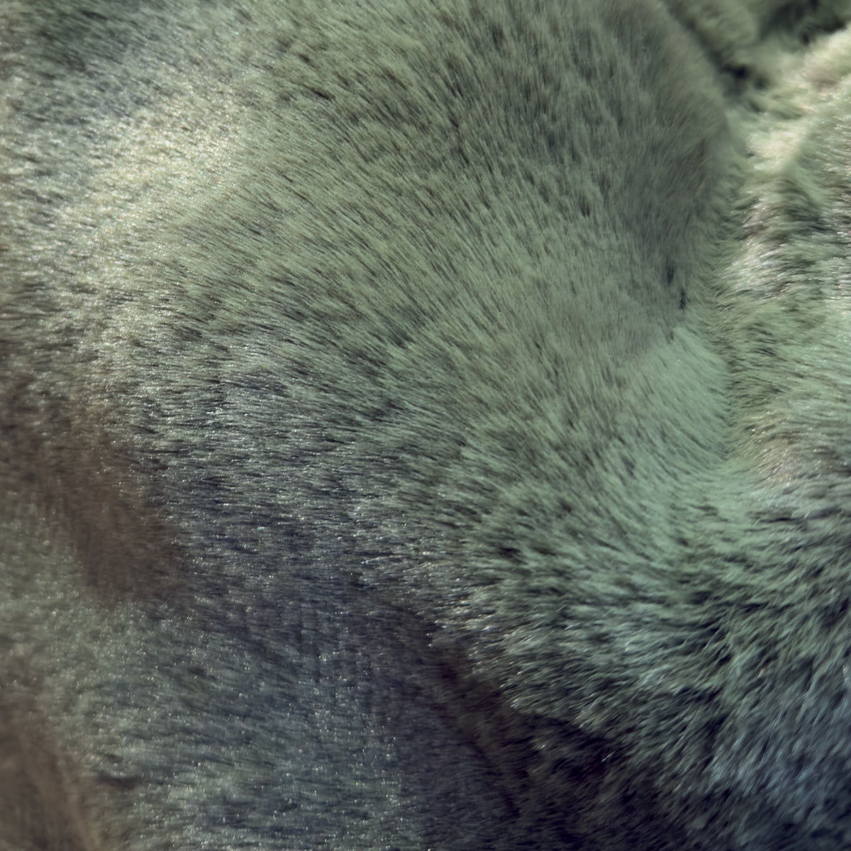 Close up for a dark green faux fur