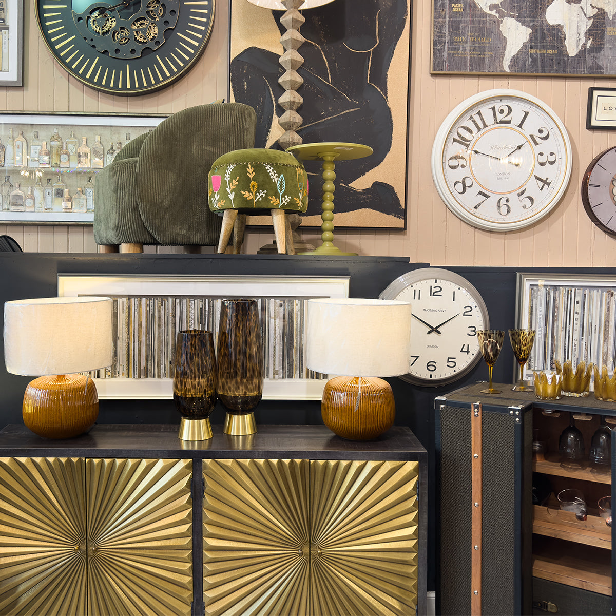 A olive and mustard decorated shop with golden starburst sideboard