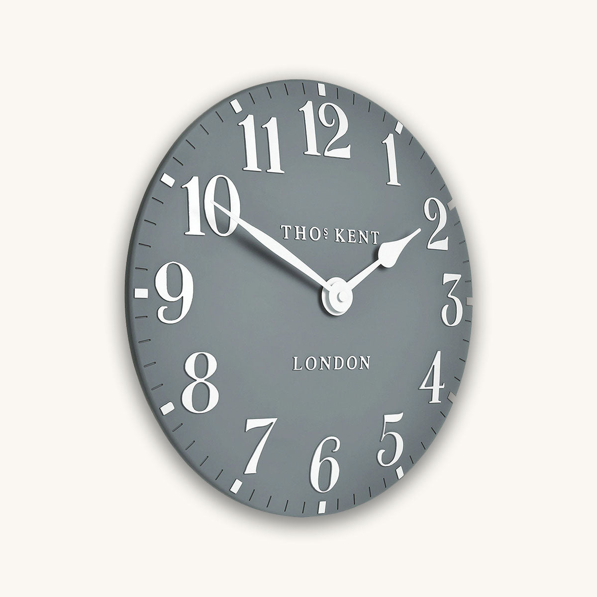 Gray wall clock with white numbers and Thomas Kent branding on a white background