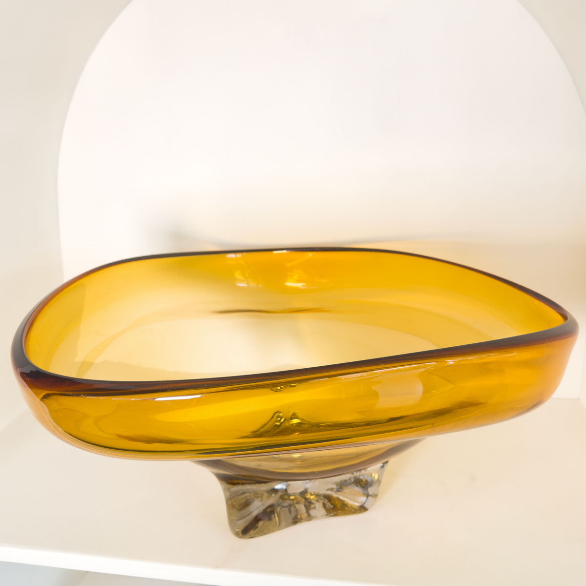 Amber glass bowl on a white background