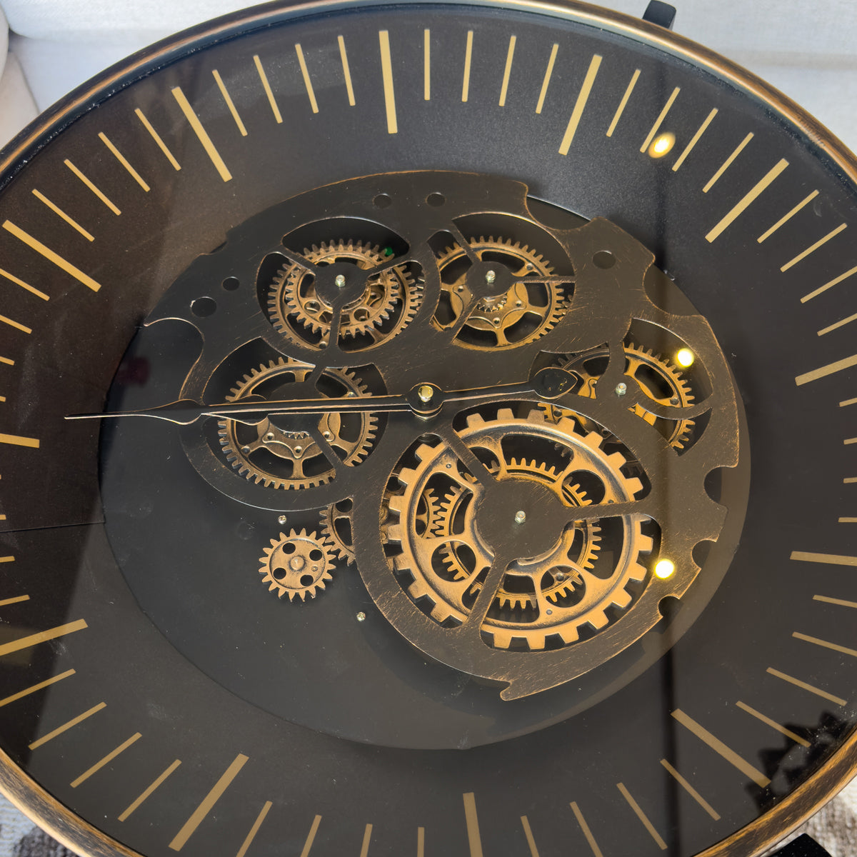 Mechanical clock table with visible gears and black face