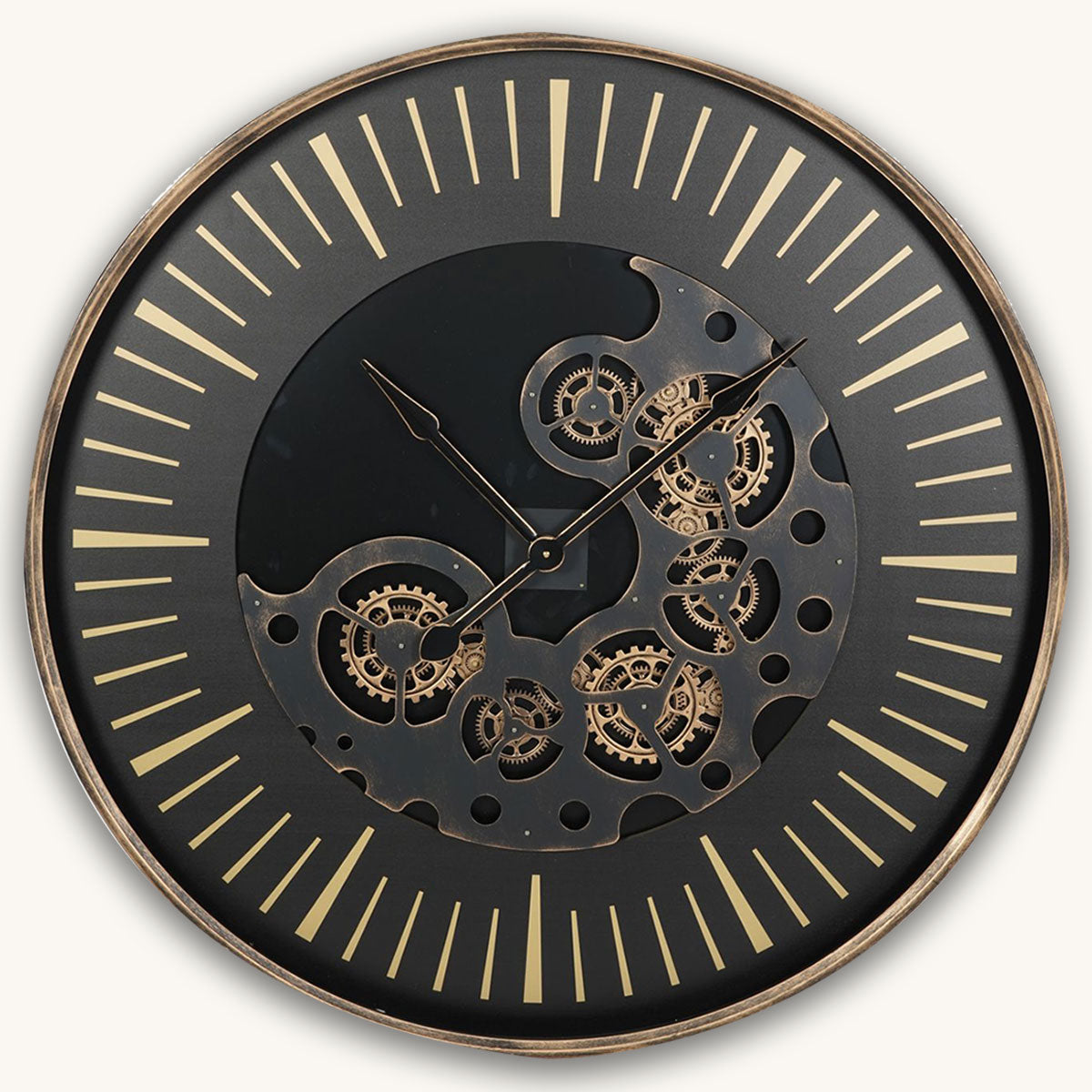 Decorative wall clock with mechanical design on a black face and gold accents