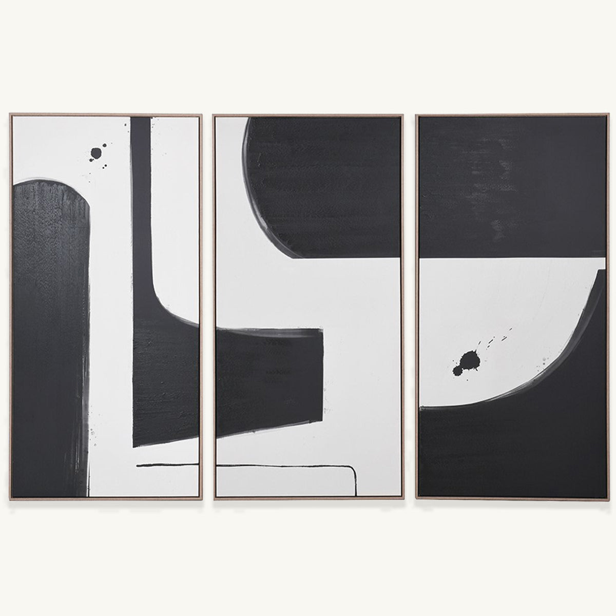 A triptych of wall canvases featuring a bold geometric monochrome pattern.