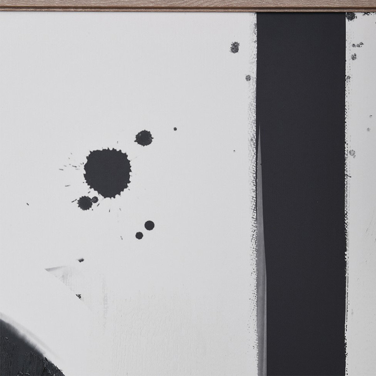 A close up of a black & white framed wall art featuring geometric shapes and paint splatters.
