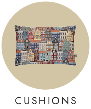 Decorative pillow with cityscape design on a beige background
