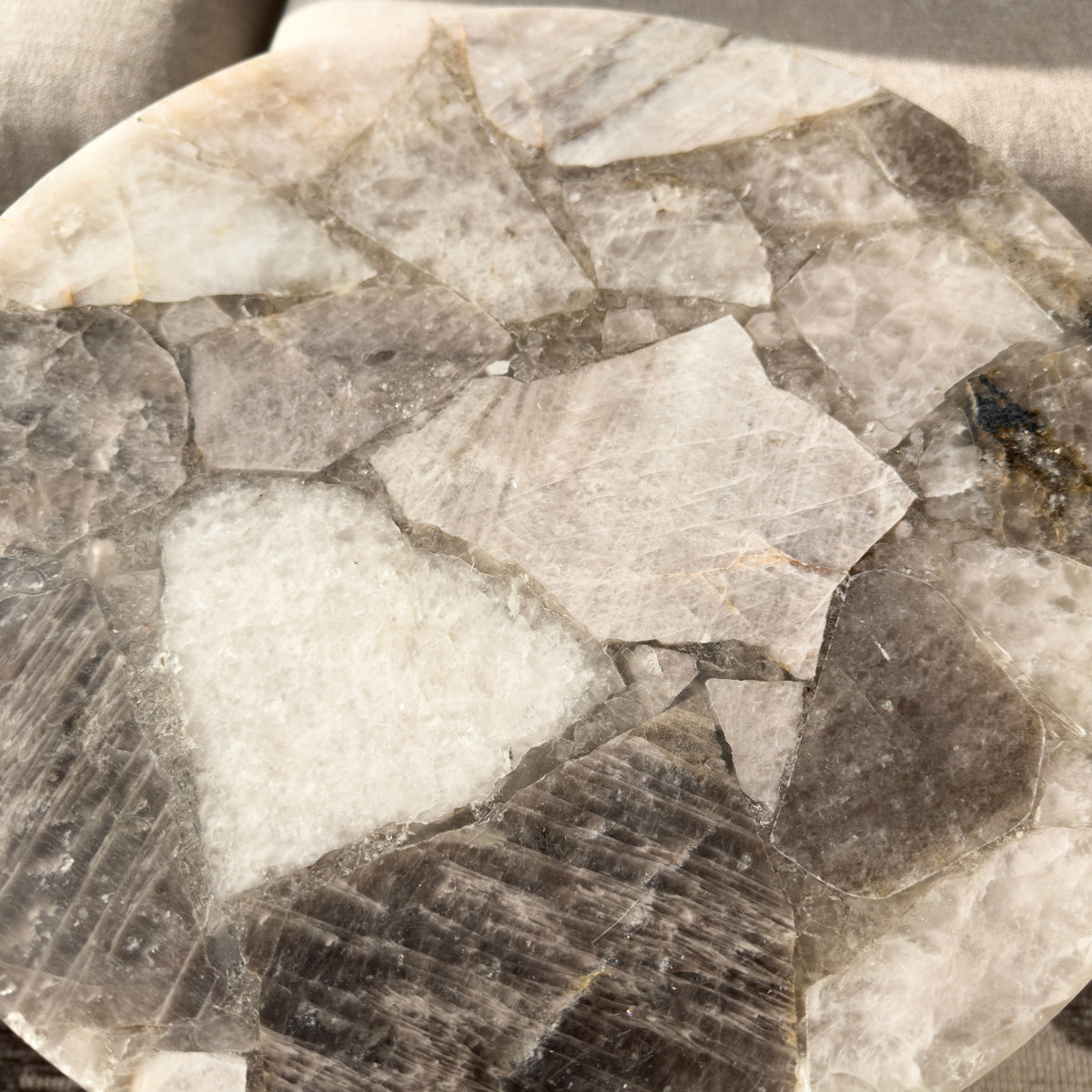 Close-up of a stone surface with various shades of gray and brown.