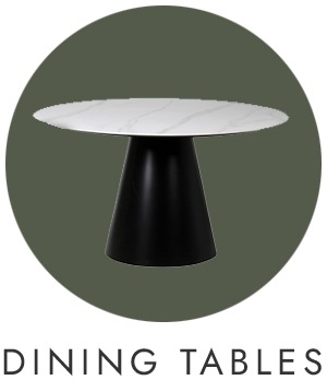 Modern dining table with black base and white marble top on a green background