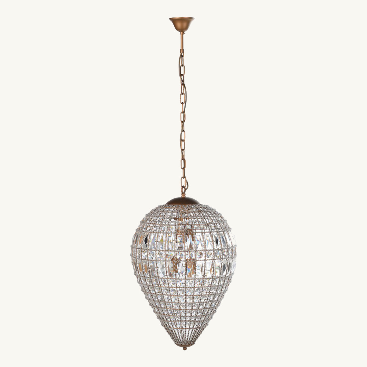 A teardrop-shaped crystal chandelier with brass hardware, hanging from a chain.