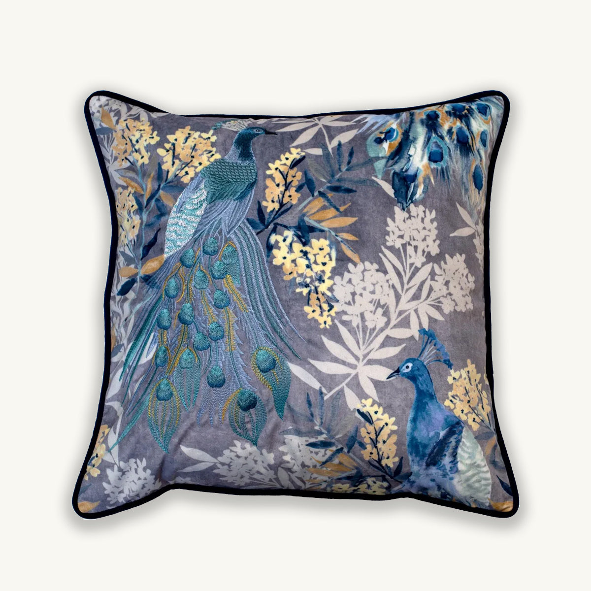 Decorative pillow with peacock and floral pattern on a gray background