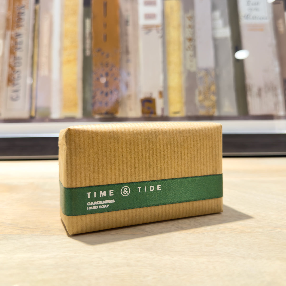 Bar of soap with 'Time & Tide' branding on a wooden surface.