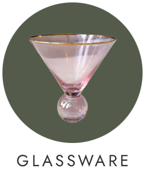 Pink martini glass with gold rim on a green background, labeled 'Glassware'.
