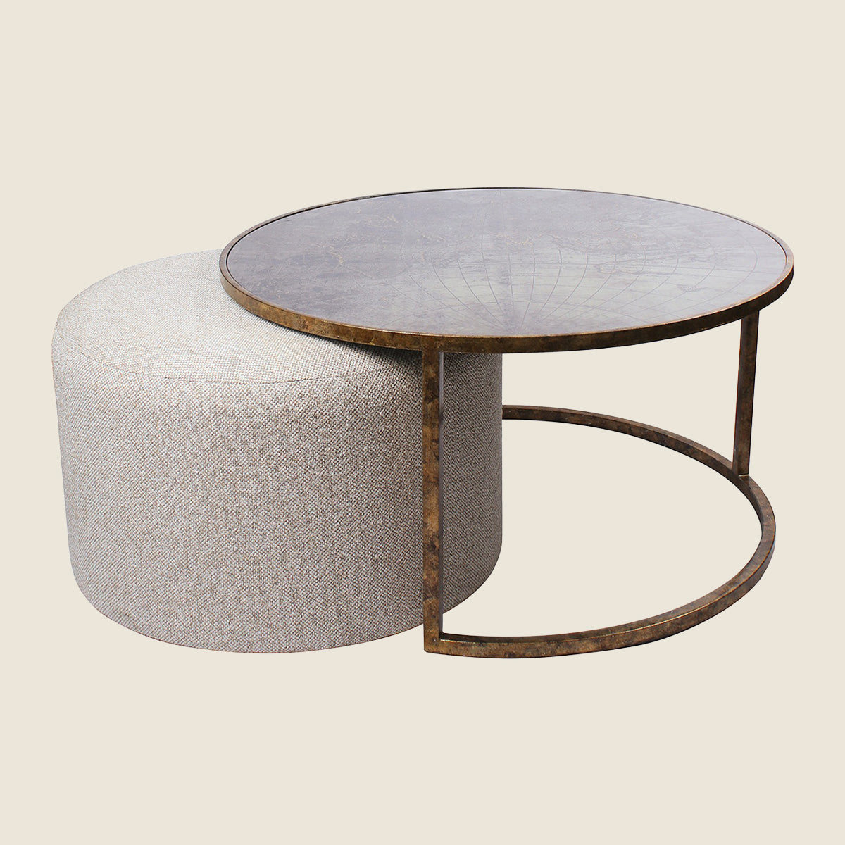 A atlas map coffee table which comprises a map motif top table in antique gold, with a cream fabric ottoman which nests underneath.