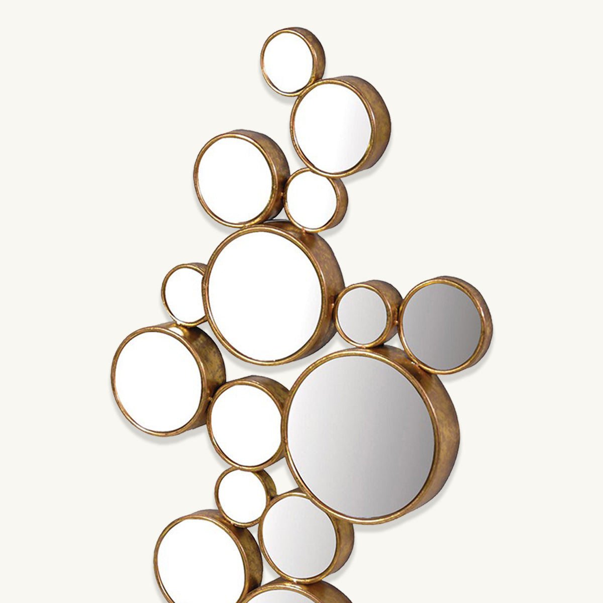 A close up of a mirror made up of smaller round mirrors with gold frames.