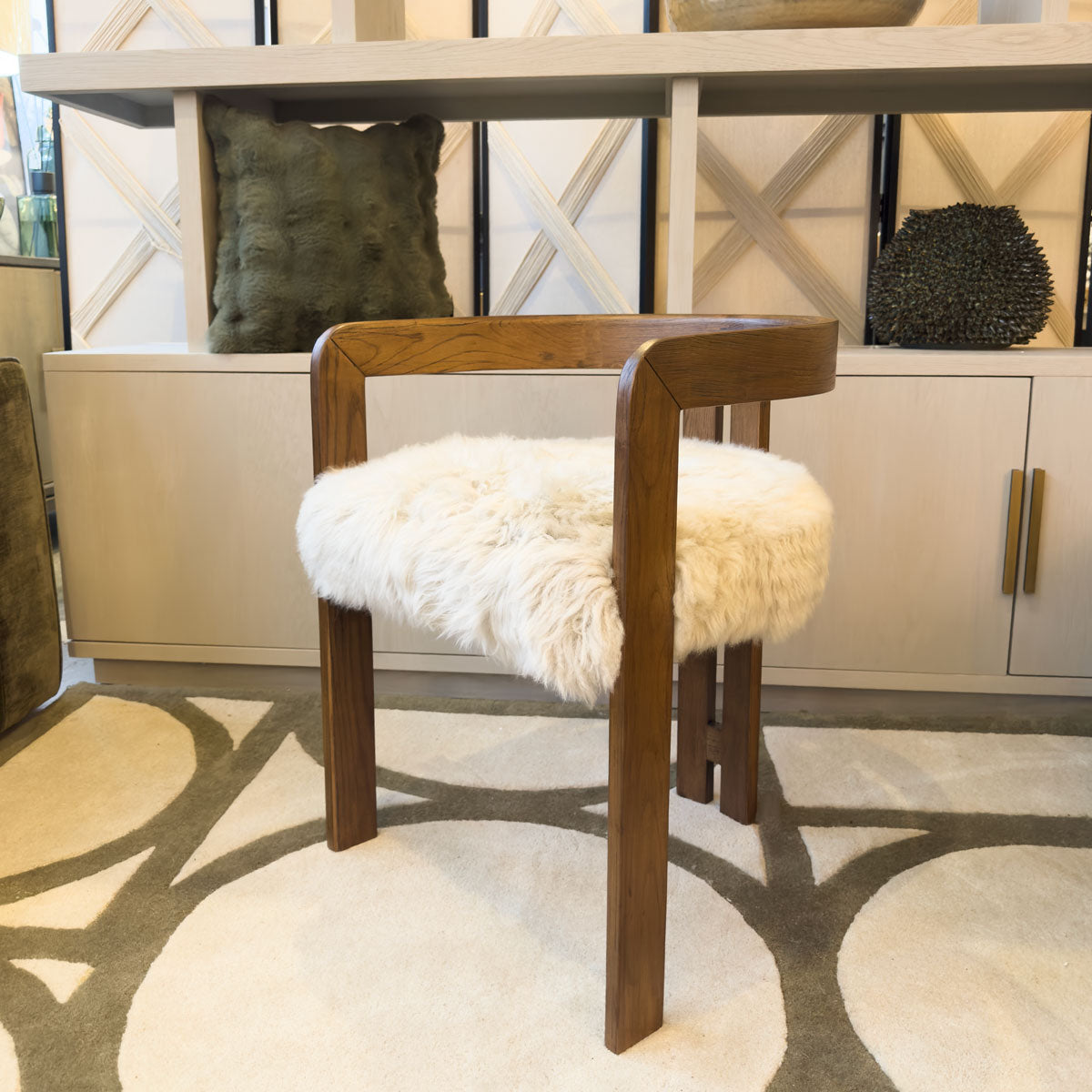 A fluffy dining chair made from sheepskin and oak in living room