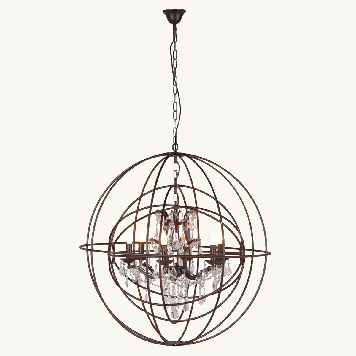 A chandelier featuring intricate metalwork forming a sphere shape, with drop crystals in centre.