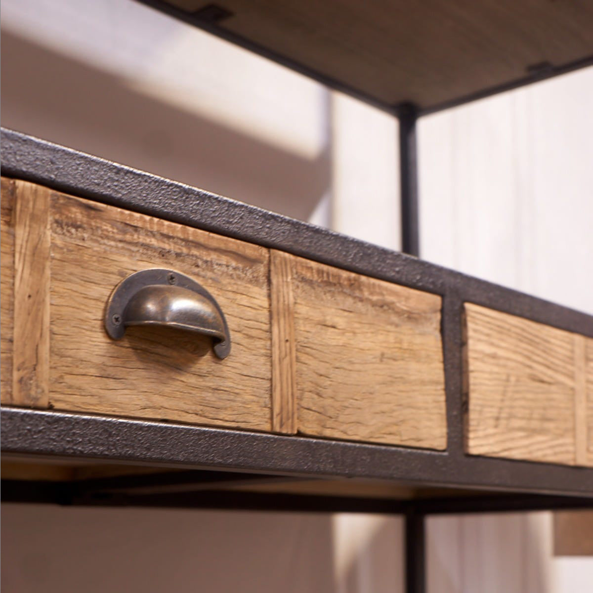 Wooden drawer with metal handle on a rustic cabinet