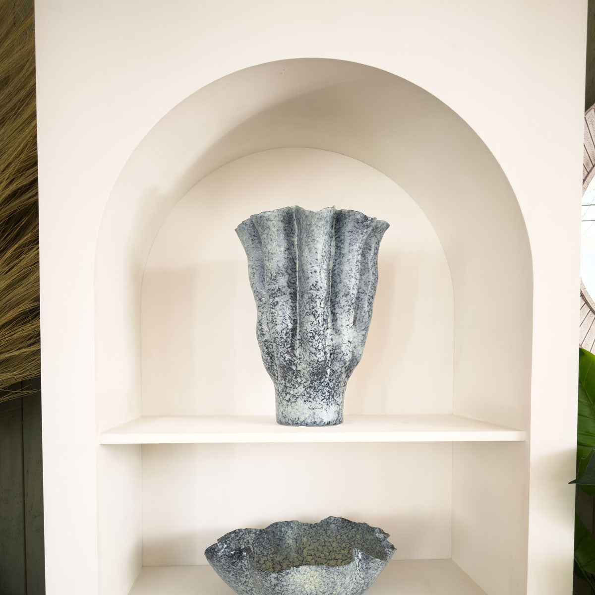 Decorative vase on a shelf with a neutral background