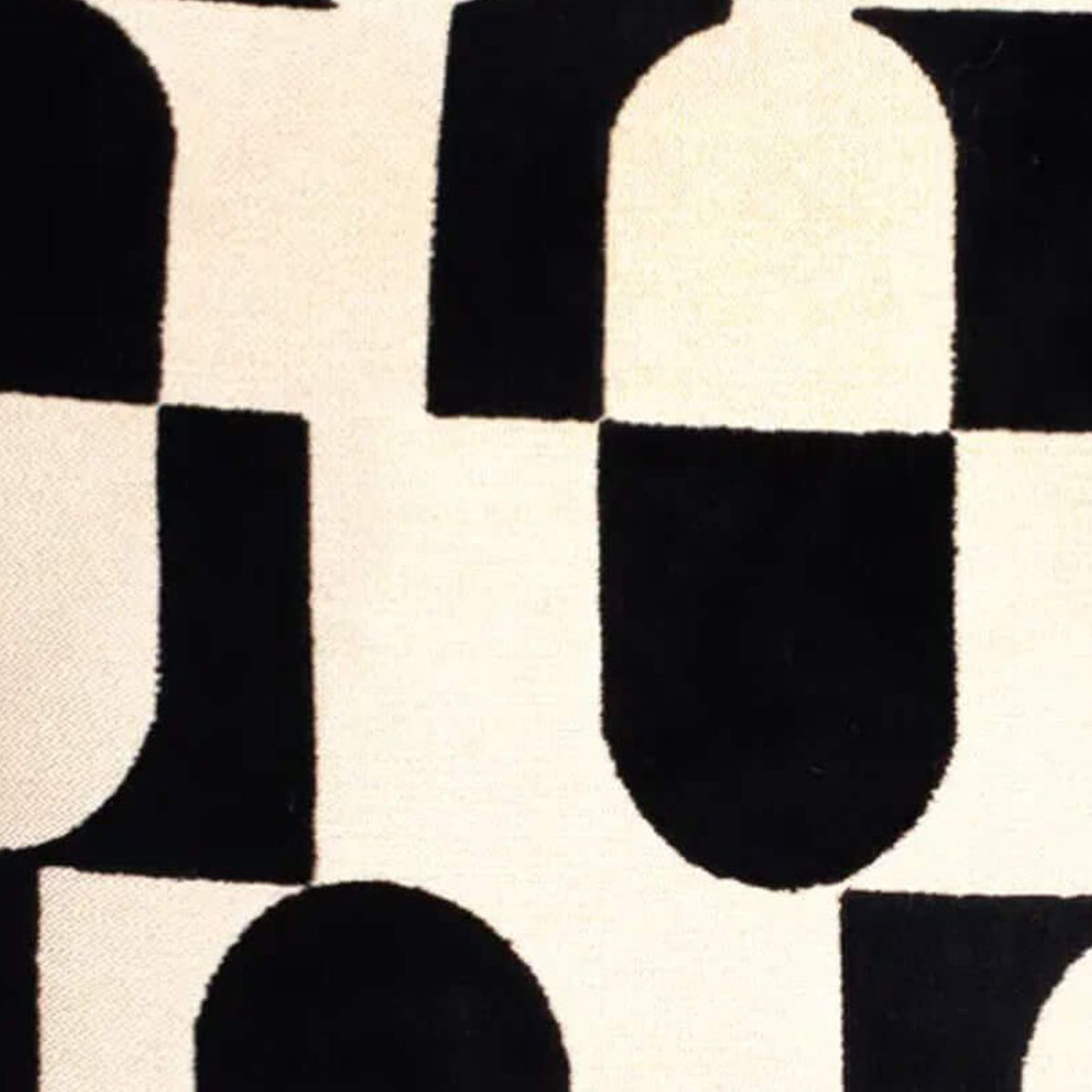 Close-up of a black and white geometric patterned cushion