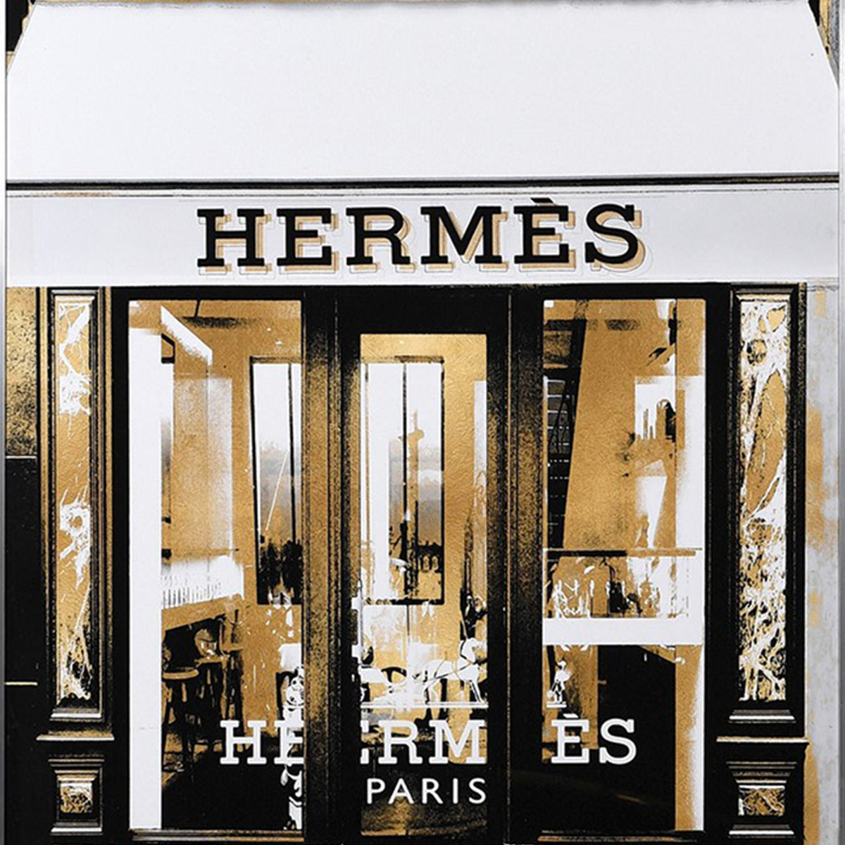 A close up of a Parisian storefront of a famous french fashion designer brand.