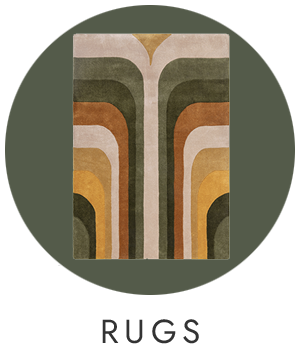 Geometric patterned rug with earthy tones on a dark green background, labeled 'RUGS'.