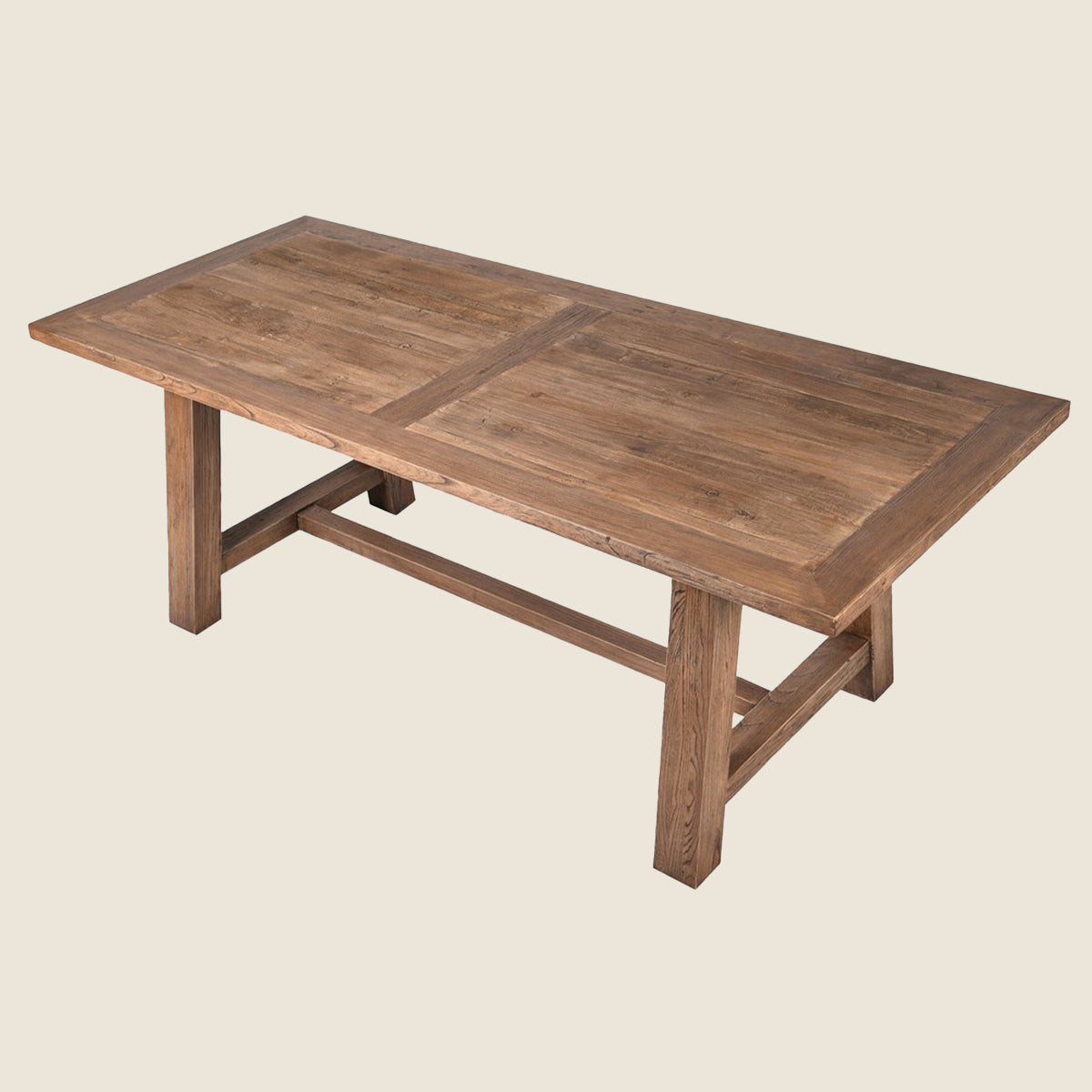A rustic rectangular wooden dining table with a warm medium-brown finish, featuring a central seam on the tabletop and a sturdy trestle-style base, shown against a solid light beige background.