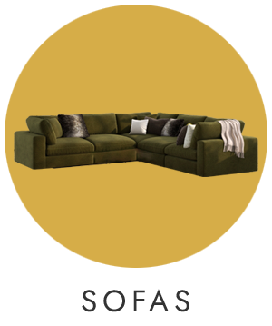 Green sectional sofa with cushions on a mustard yellow background, labeled 'SOFAS'.