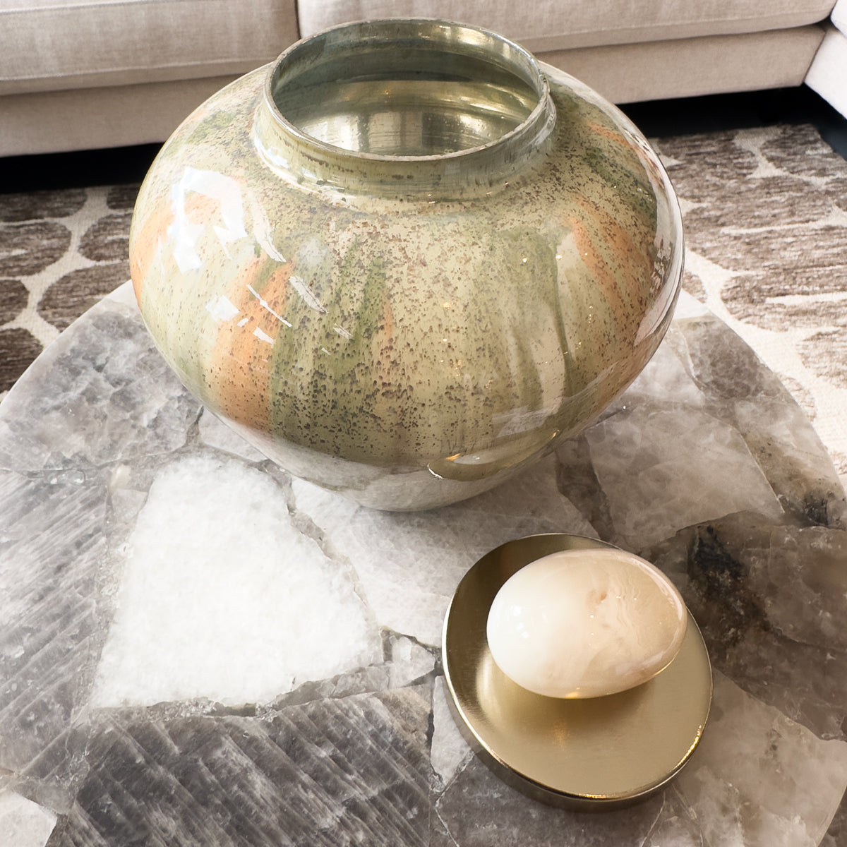 Decorative vase with lid on a marble surface