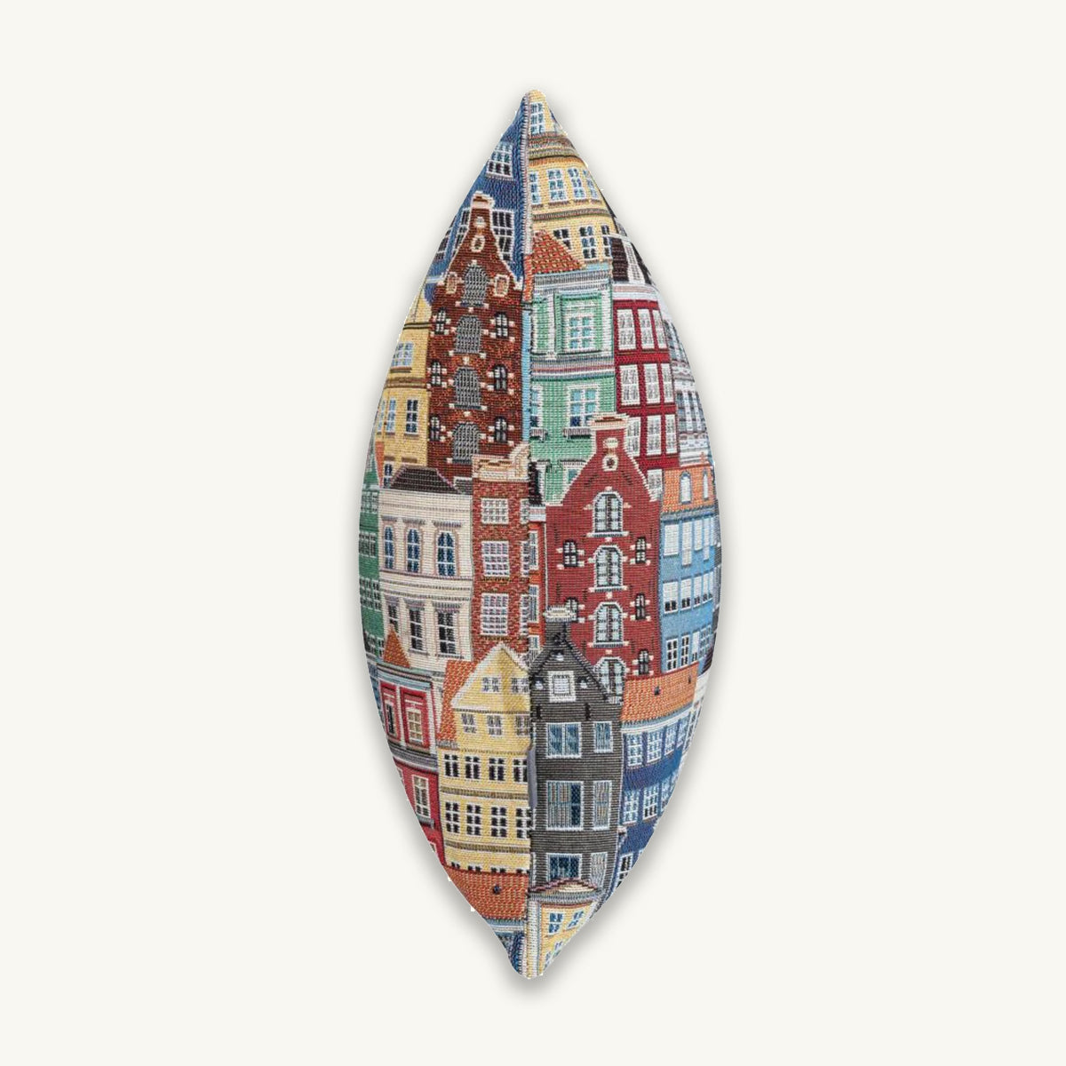 Decorative cushion with a colorful cityscape pattern on a white background