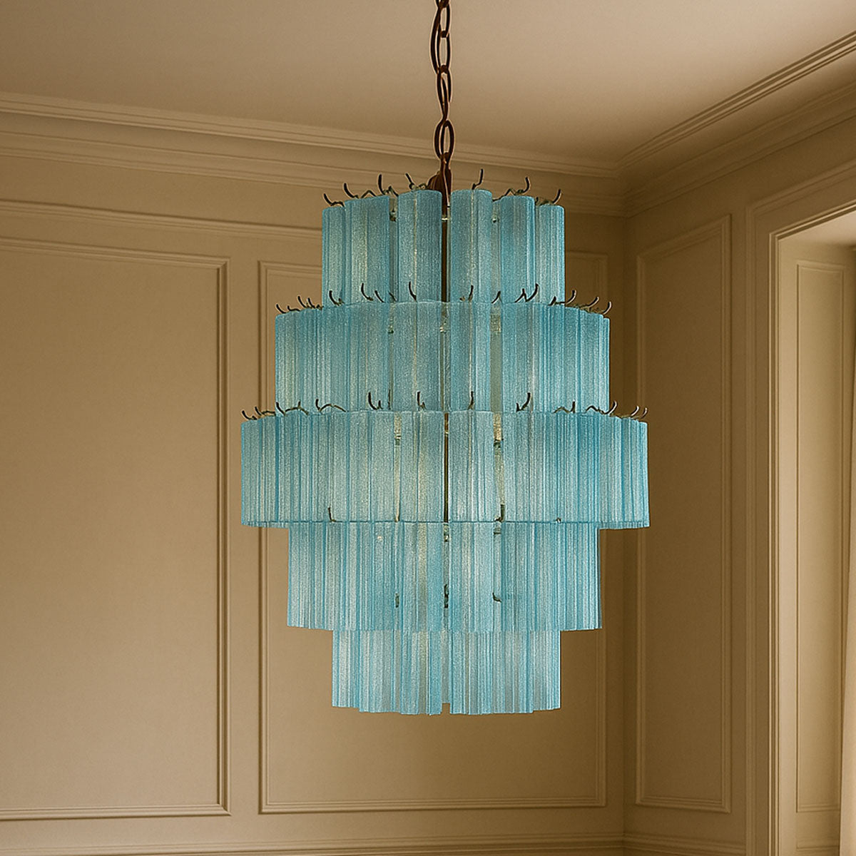 Turquoise chandelier hanging in a room with beige walls