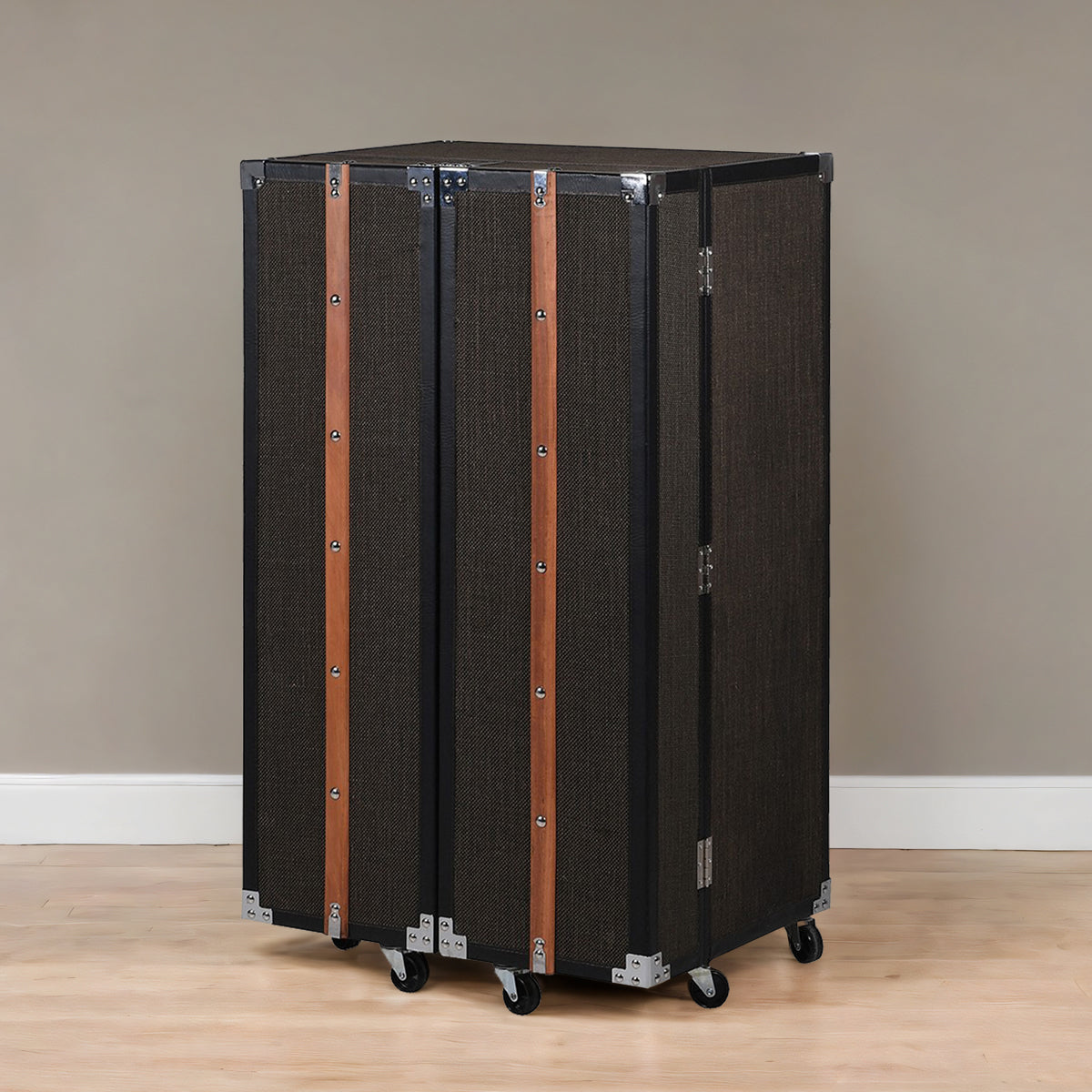 A Tweed & Wood Trim Bar Trunk Cabinet with black fabric and brown wood trim, on wheels, against a neutral background.