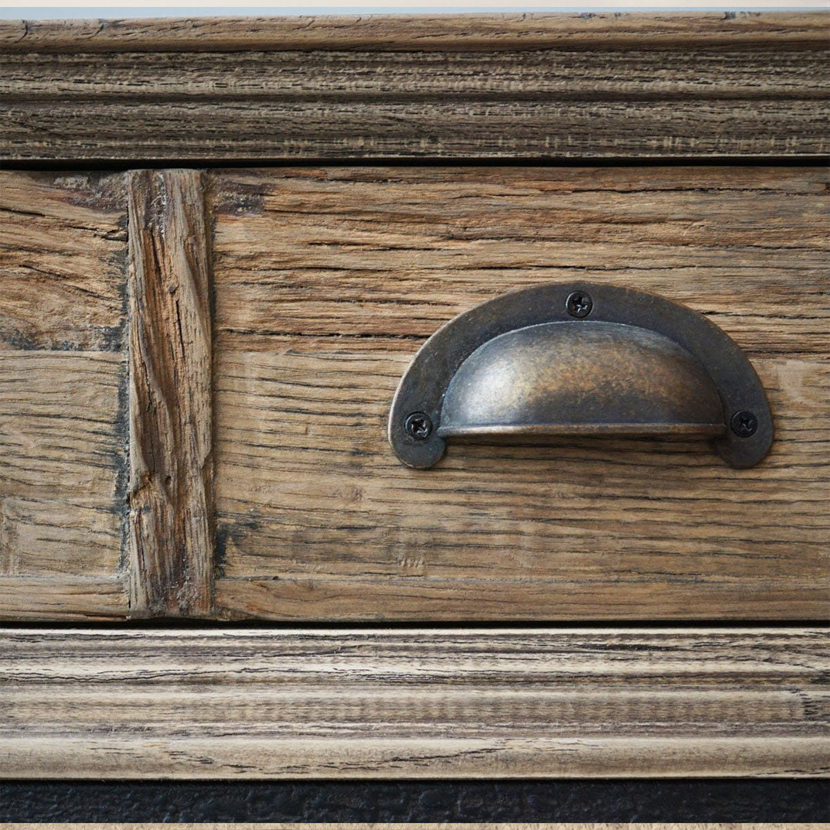 Close-up of a wooden drawer with a metal handle