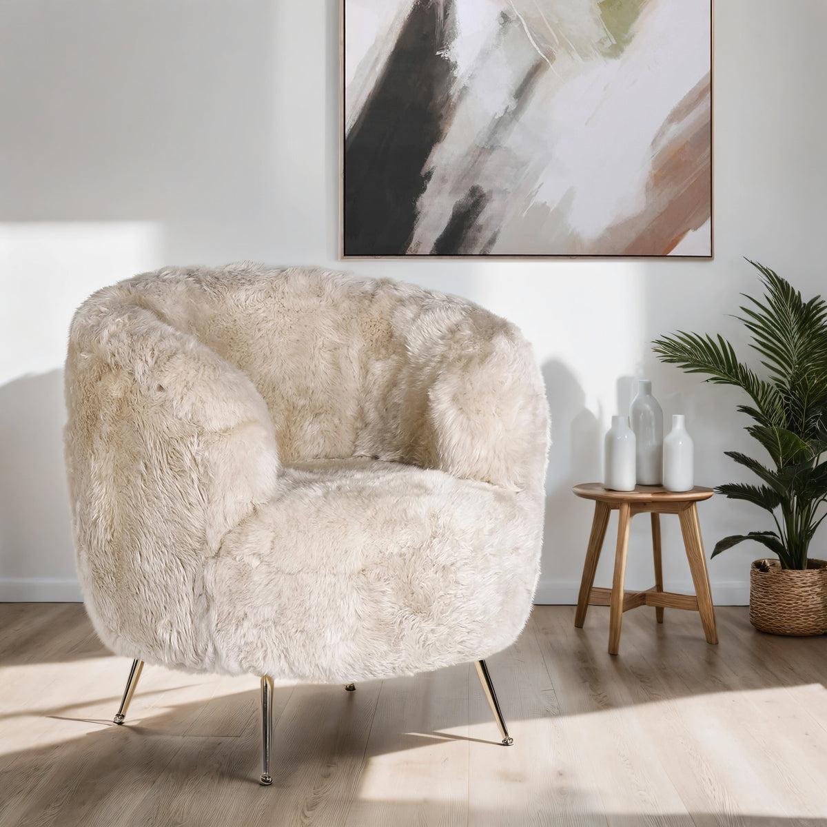 A cream teddy tub chair in a living room with an abstract canvas above.
