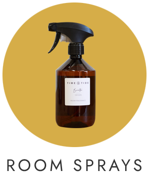 A yellow circle with a picture of a scented room mist in the centre.