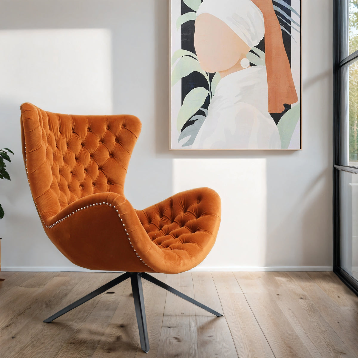 A burnt orange buttoned wing chair in a neutral living room with an abstract canvas on wall.