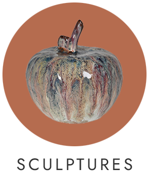 A watercolour apple sculpture on a red circle